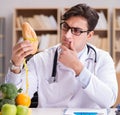 Doctor in dieting concept with fruits and vegetables