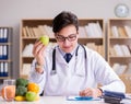 Doctor in dieting concept with fruits and vegetables