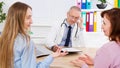 Doctor discusses something with his patients,medical insurance