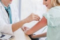 A doctor disinfects on arm`s skin before injection Royalty Free Stock Photo