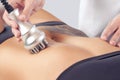 The doctor does the Rf lifting procedure on the stomach and hips of a woman in a beauty parlor. Royalty Free Stock Photo