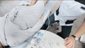 doctor does an ultrasound of the veins on the patient's legs. A phlebologist checks the veins on a woman's legs