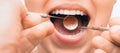 Doctor doing dental treatment to his patient in clinic.