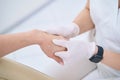 Woman in the medical and cosmetology center on the procedure of hand massage Royalty Free Stock Photo