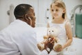 Doctor doing a health checkup on a teddy bear Royalty Free Stock Photo