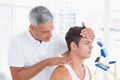 Doctor doing neck adjustment Royalty Free Stock Photo