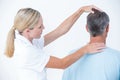 Doctor doing a neck adjustment