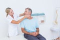 Doctor doing neck adjustment Royalty Free Stock Photo