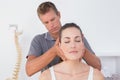 Doctor doing neck adjustment