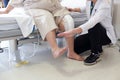 Doctor doing Physical therapy for Patient with a knee injury Royalty Free Stock Photo