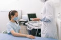 Doctor doing the ultrasound on the hand close up. Doctor demonstrates results of ultrasound to patient. Medical Royalty Free Stock Photo