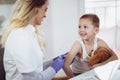 Doctor doing vaccine injection to a child