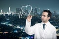 Doctor drawing cardiogram on city background