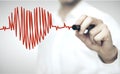 Doctor drawing red heart symbol Royalty Free Stock Photo