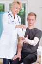 Doctor dressing upper limb