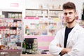 Doctor in drugstore in front of the desck