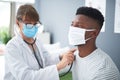 Doctor, exam and woman with patient listening to heart, breathing or medical healthcare test for covid in hospital Royalty Free Stock Photo