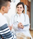 Doctor examinating teen boy with quinsy at home