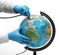 Doctor examine globe Royalty Free Stock Photo