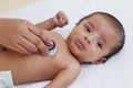 Doctor examine newborn with stethoscope Royalty Free Stock Photo