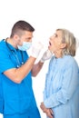 Doctor examine senior throat Royalty Free Stock Photo