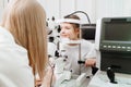 doctor examines girl with slit lamp. equipping ophthalmologist's office. Royalty Free Stock Photo