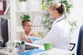 Doctor examines an injured hand a little boy Royalty Free Stock Photo