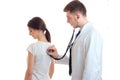 Doctor examines a woman with a stethoscope