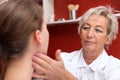 Doctor examines a young patient Royalty Free Stock Photo