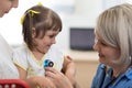 Doctor examining baby with stethoscope in clinic. Baby health concept Royalty Free Stock Photo