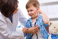 Doctor examining child