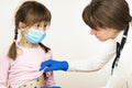 Doctor examining child girl covered with green rashes on face and stomach ill with chickenpox, measles or rubella virus Royalty Free Stock Photo