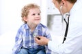 Doctor examining a child patient by stethoscope Royalty Free Stock Photo