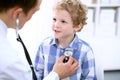 Doctor examining a child patient by stethoscope Royalty Free Stock Photo