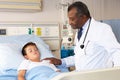 Doctor Examining Child Patient On Ward Royalty Free Stock Photo