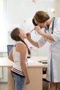 Doctor examining child`s throat and mouth Royalty Free Stock Photo