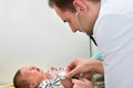 Doctor examining crying baby Royalty Free Stock Photo