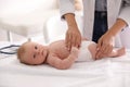 Doctor examining cute baby indoors. Health care Royalty Free Stock Photo