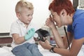 Doctor Examining cute little boy