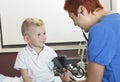 Doctor Examining cute little boy