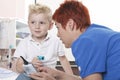 Doctor Examining cute little boy