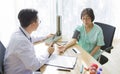 Doctor is examining Elderly woman patient using a stethoscope Royalty Free Stock Photo