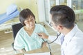 Doctor is examining Elderly woman patient using a stethoscope. Royalty Free Stock Photo