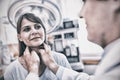 Doctor examining a female patients neck Royalty Free Stock Photo
