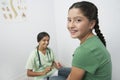 Doctor Examining Girl With Reflex Hammer Royalty Free Stock Photo