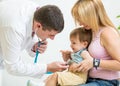 Doctor examining kid patient with stethoscope