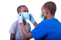 Doctor examining a little boy Royalty Free Stock Photo