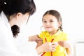 Doctor examining little girl by stethoscope Royalty Free Stock Photo