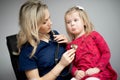 Doctor examining a little girl by stethoscope Royalty Free Stock Photo