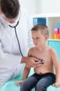 Doctor examining a little patient Royalty Free Stock Photo